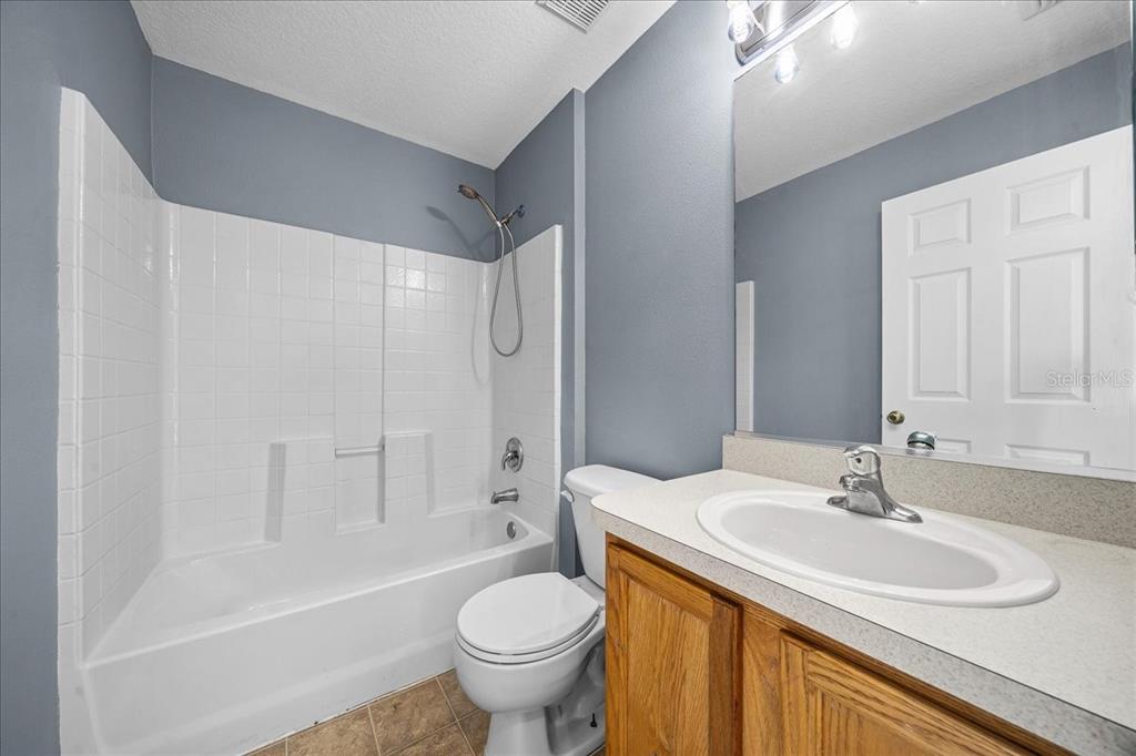 155 Juniper Way Ocala, FL 34480 - Photo 33 of 67 a bathroom with a sink toilet and shower