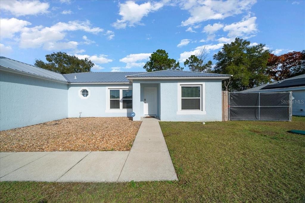 155 Juniper Way Ocala, FL 34480 - Photo 38 of 67 front view of house with a yard