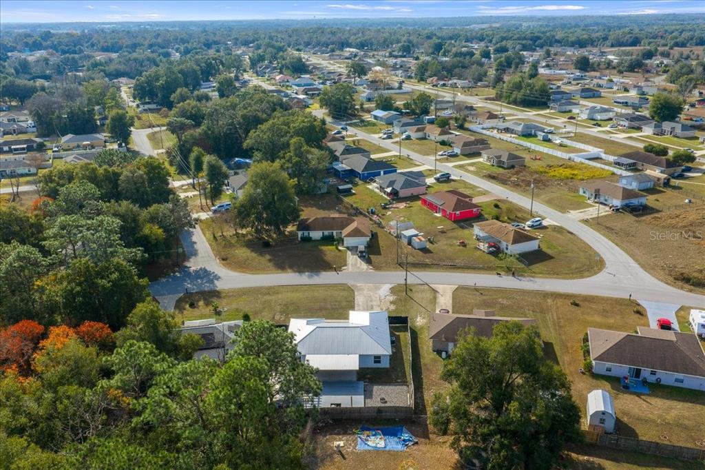 155 Juniper Way Ocala, FL 34480 - Photo 49 of 67 an aerial view of residential houses with outdoor space and trees