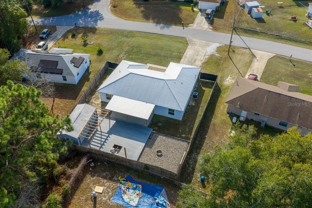 155 Juniper Way Ocala, FL 34480 - Photo 50 of 67 an aerial view of a house with swimming pool and outdoor space