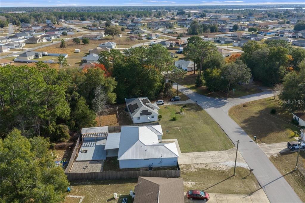 155 Juniper Way Ocala, FL 34480 - Photo 51 of 67 an aerial view of a house with a yard