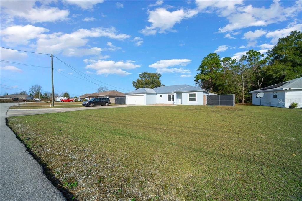 155 Juniper Way Ocala, FL 34480 - Photo 53 of 67 a view of a house with a big yard