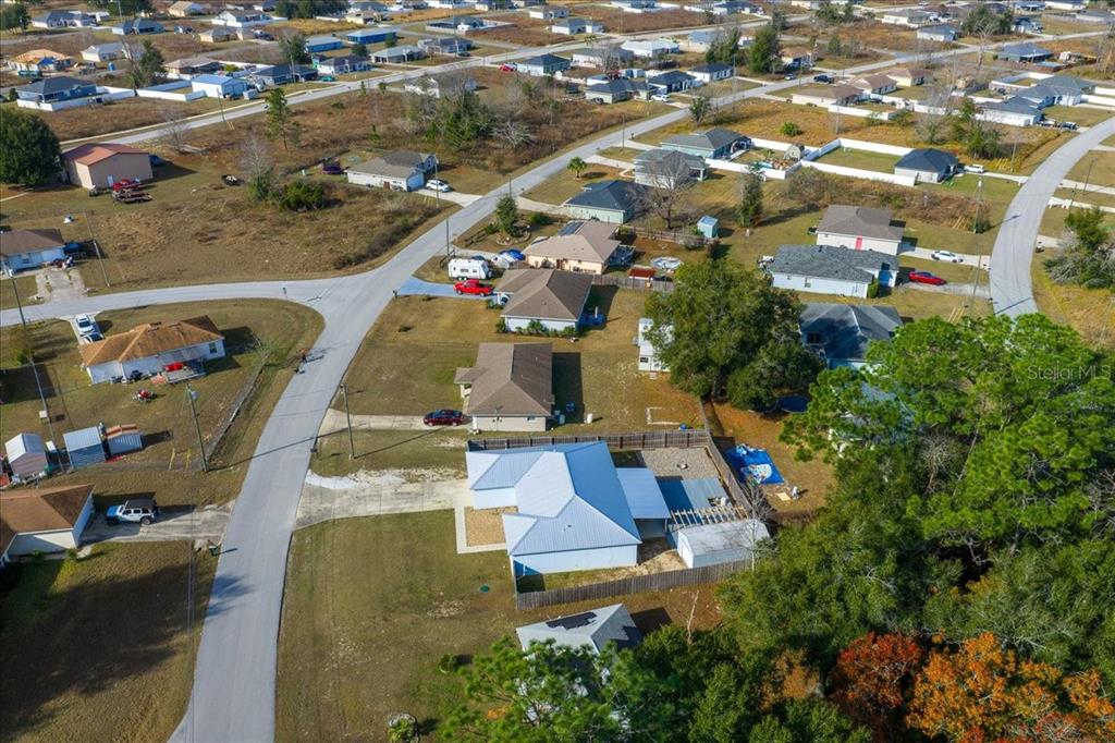 155 Juniper Way Ocala, FL 34480 - Photo 66 of 67 an aerial view of residential houses with outdoor space