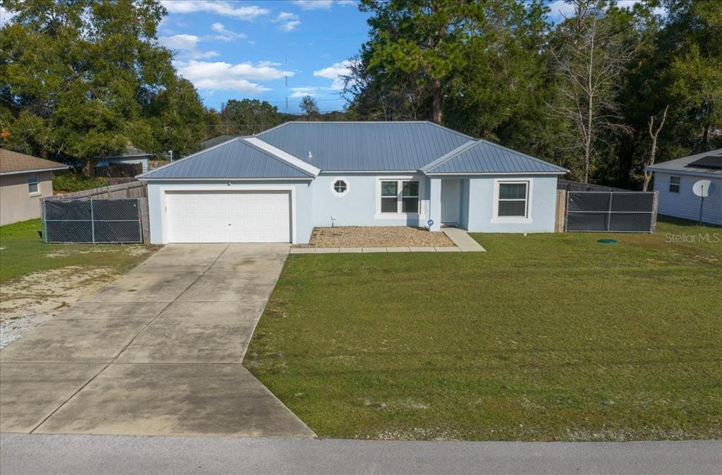 155 Juniper Way Ocala, FL 34480 - Photo 67 of 67 a front view of a house with yard
