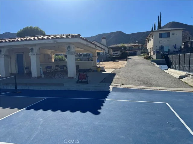 a view of a chairs and table in the patio