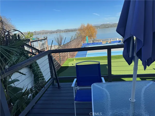 a view of a room with furniture and wooden floor