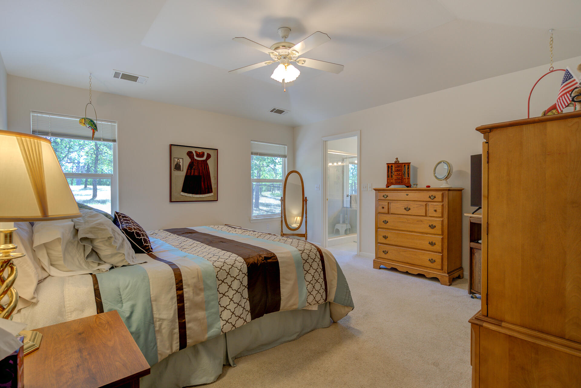 13223 Padani Drive Redding, CA 96003 - Photo 16 of 48 a bed room with a bed and a chandelier