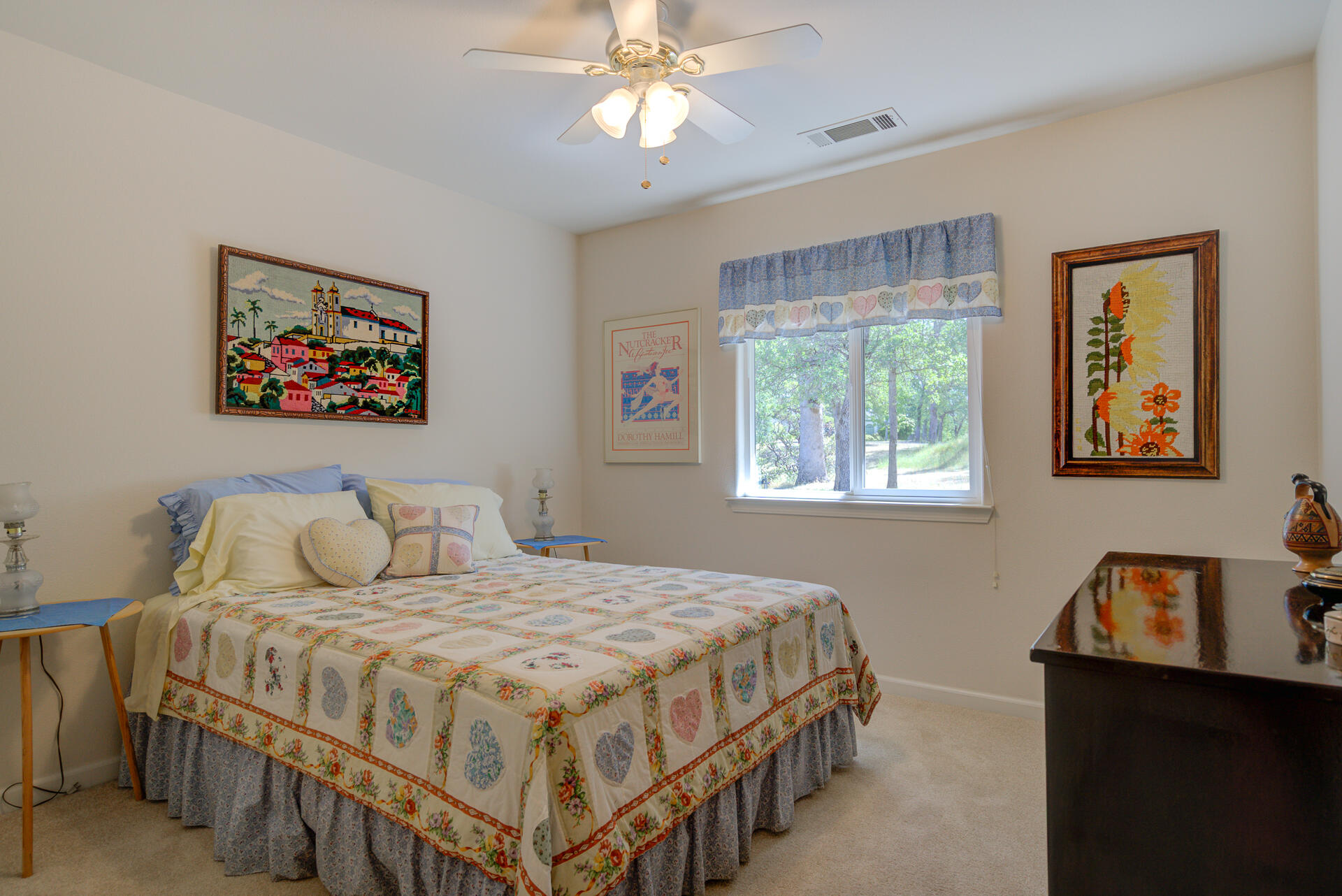 13223 Padani Drive Redding, CA 96003 - Photo 23 of 48 a bedroom with a bed and a chandelier