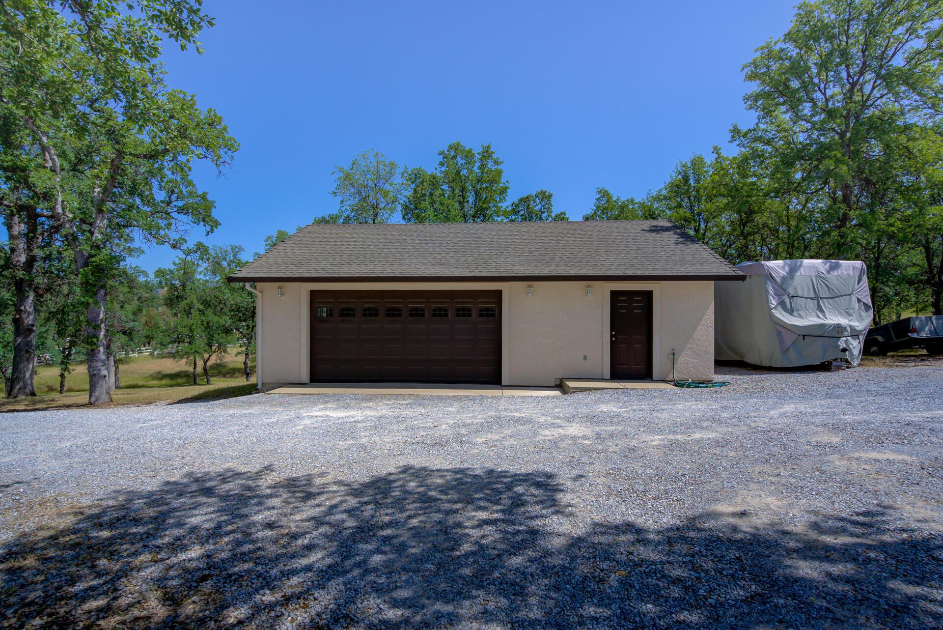 13223 Padani Drive Redding, CA 96003 - Photo 4 of 48 a front view of a house with a yard and garage