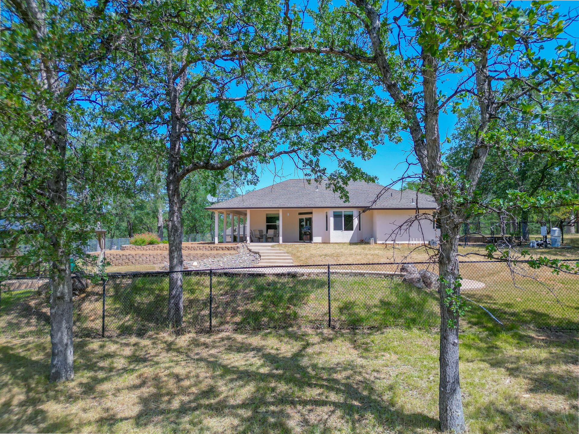 13223 Padani Drive Redding, CA 96003 - Photo 47 of 48 a front view of a house with a yard