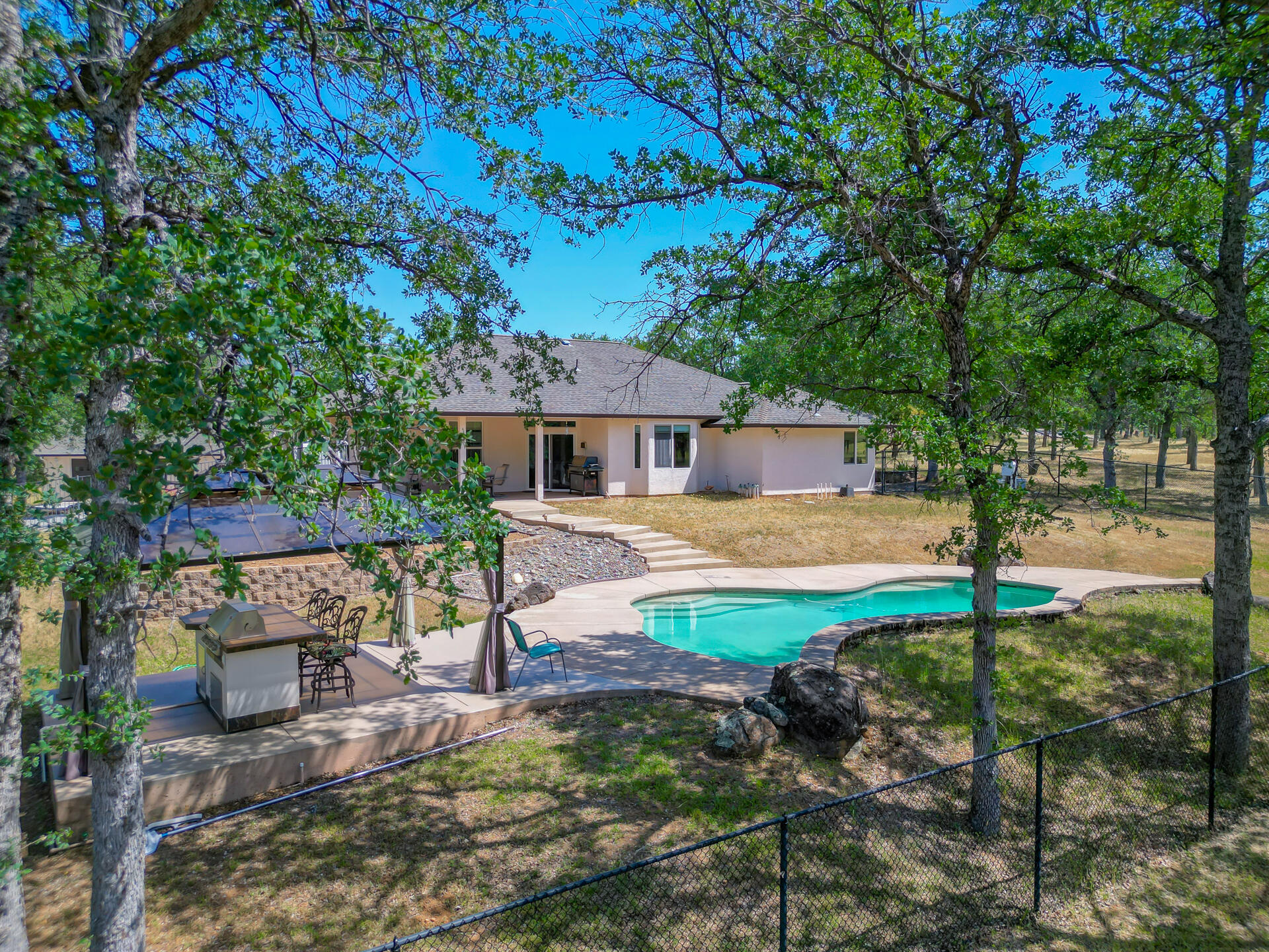 13223 Padani Drive Redding, CA 96003 - Photo 48 of 48 a view of a house with backyard and sitting area