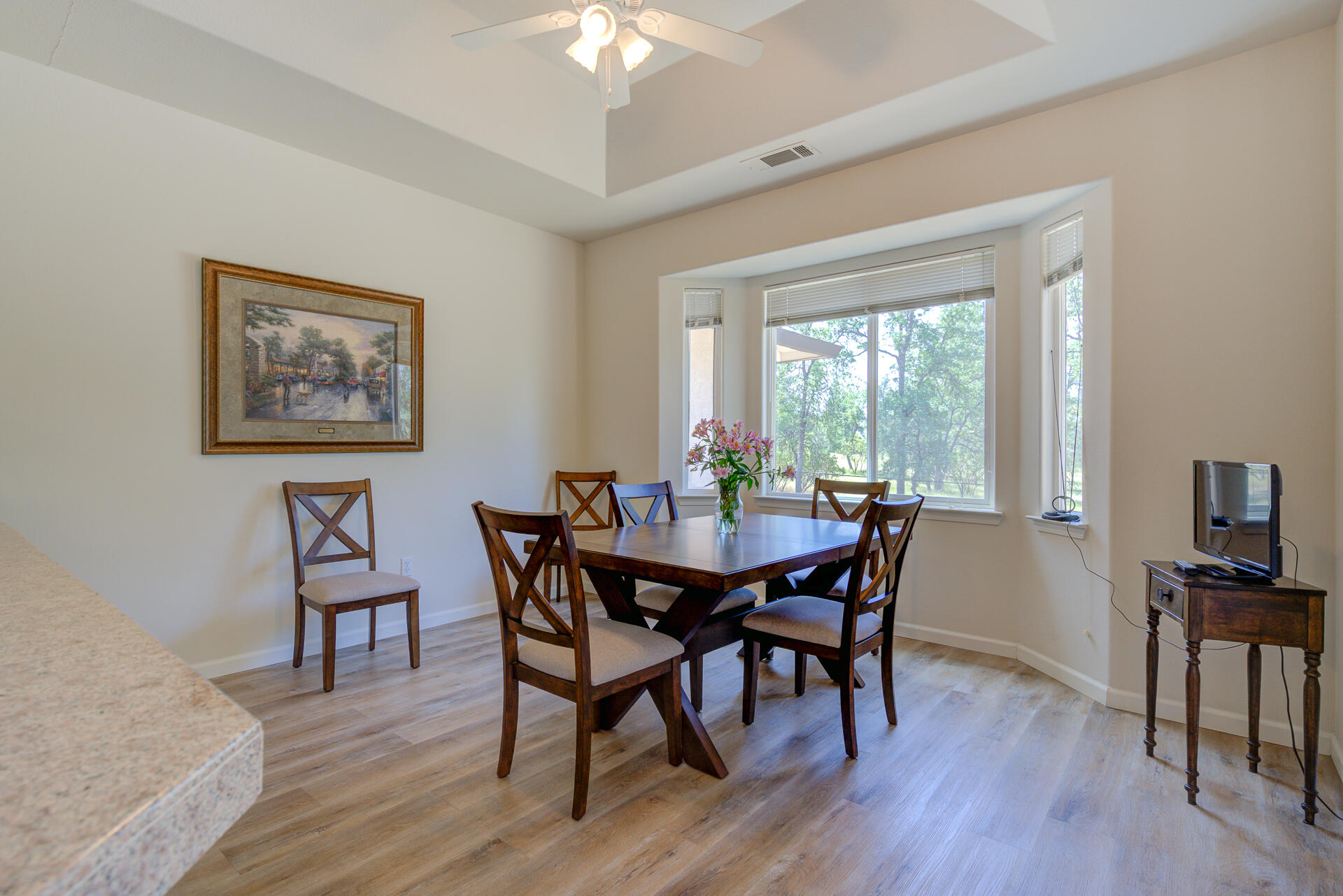 13223 Padani Drive Redding, CA 96003 - Photo 8 of 48 a view of a dining room with furniture window and wooden floor