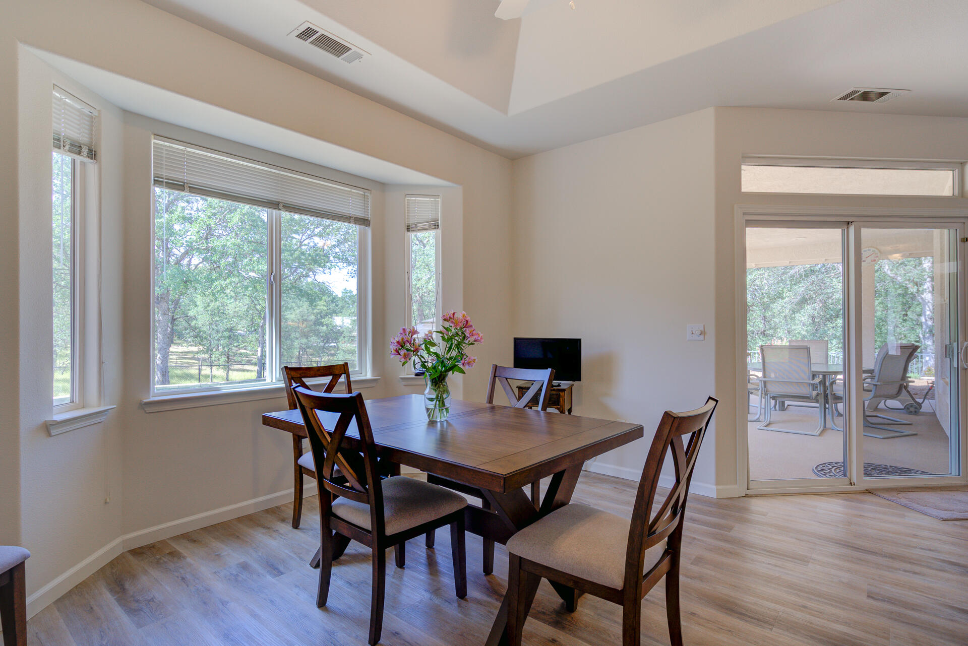 13223 Padani Drive Redding, CA 96003 - Photo 9 of 48 a view of a dining room with furniture and wooden floor