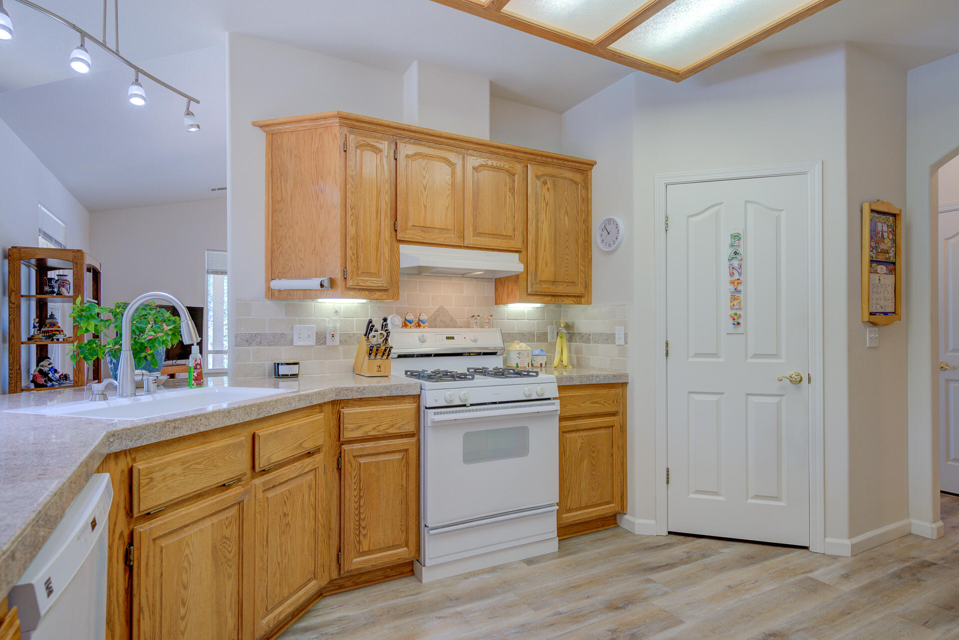 13223 Padani Drive Redding, CA 96003 - Photo 10 of 48 a kitchen with stainless steel appliances granite countertop a sink a stove and cabinets