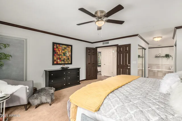 a bedroom with a bed and a dresser