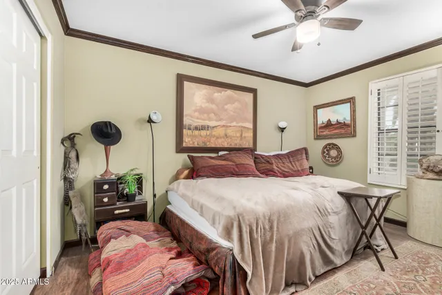 a bedroom with a bed and a table in it