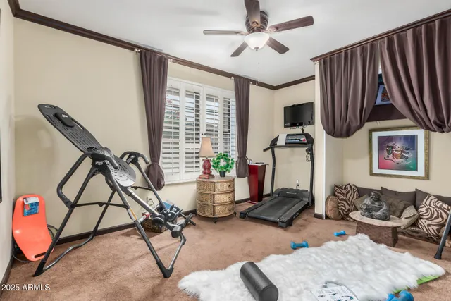 a living room with furniture a air conditioner and a window