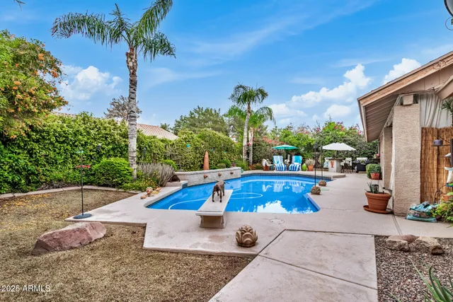 a view of a swimming pool with lounge chair