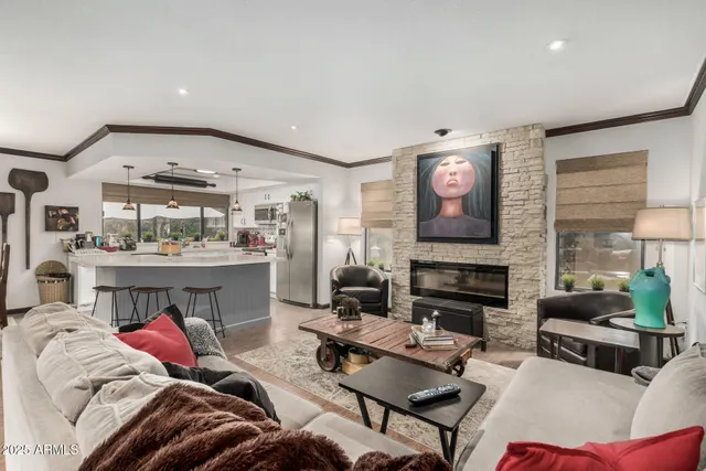 a living room with furniture and a fireplace