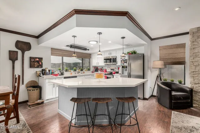 a view of a kitchen and dining area with furniture