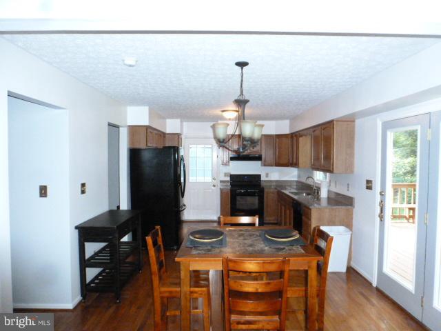 433 Pine Road Stephenson, VA 22656 - Photo 6 of 24 Updated Kitchen with side door deck access