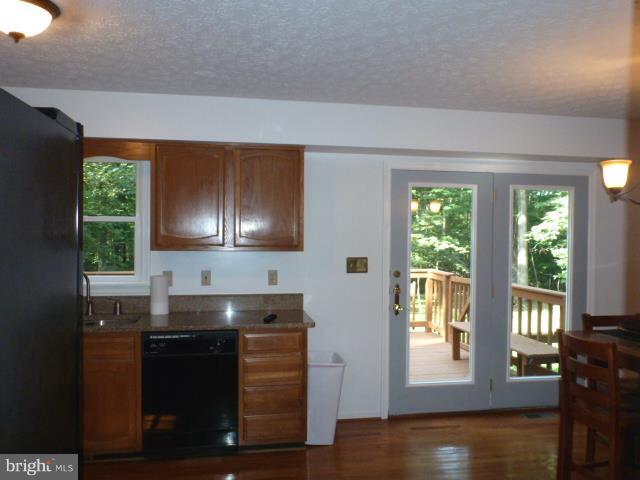433 Pine Road Stephenson, VA 22656 - Photo 7 of 24 Kitchen overlooks rear yard, woods, deck access