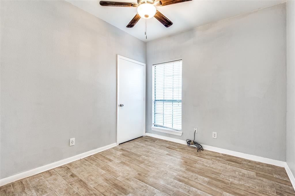 2815 Reagan Street Dallas, TX 75219 - Photo 25 of 40 a view of an empty room with a window