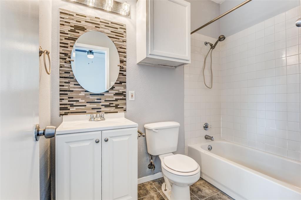 2815 Reagan Street Dallas, TX 75219 - Photo 32 of 40 a bathroom with a sink toilet and shower