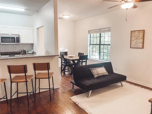 a kitchen with a stove and a refrigerator