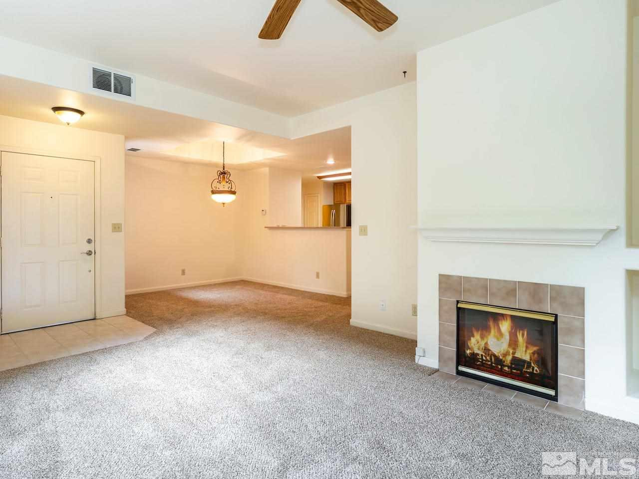 900 South, Unit 214 Reno, NV 89521 - Photo 5 of 22 an empty room with a fireplace