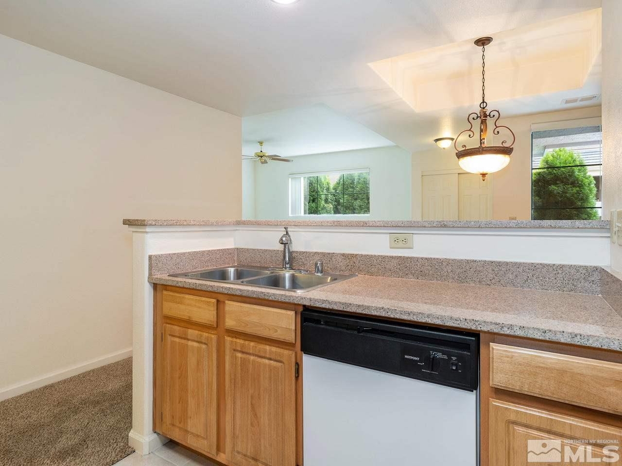 900 South, Unit 214 Reno, NV 89521 - Photo 8 of 22 a kitchen with a sink and a window