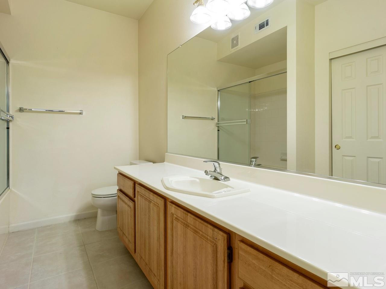 900 South, Unit 214 Reno, NV 89521 - Photo 10 of 22 a bathroom with a sink a toilet and shower