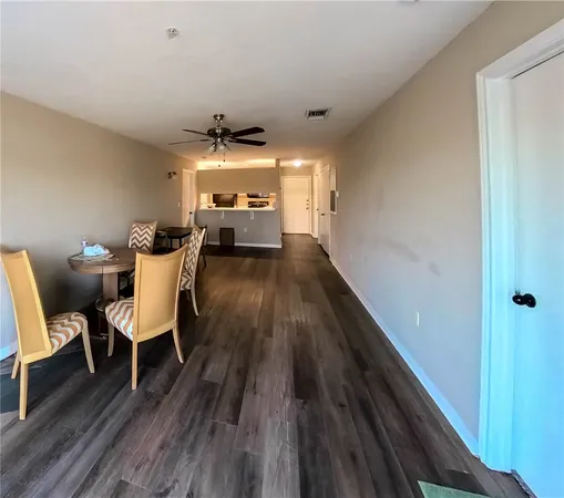 a view of a livingroom with furniture wooden floor and a window