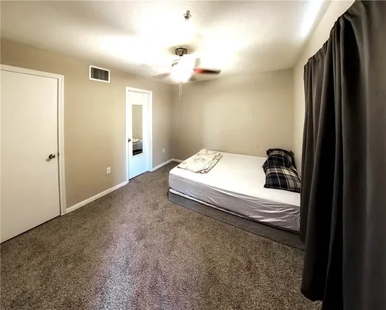 a room with a bed and a chandelier