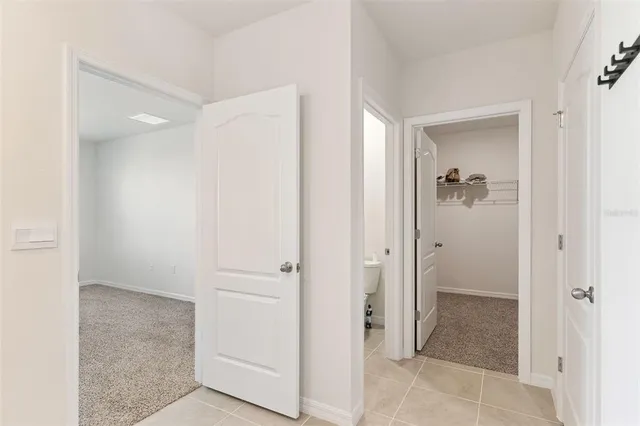 a view of a hallway with closet area