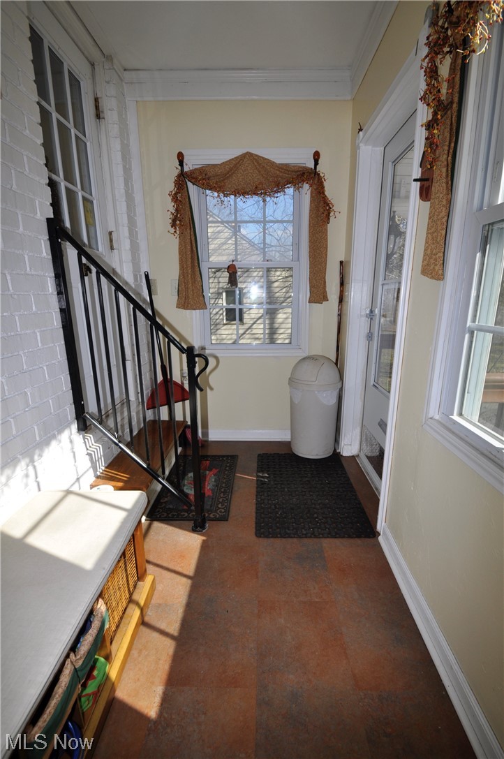 1899 West Pleasant Valley Road Parma, OH 44134 - Photo 20 of 47 Tiled entrance foyer with a healthy amount of sunlight and crown molding