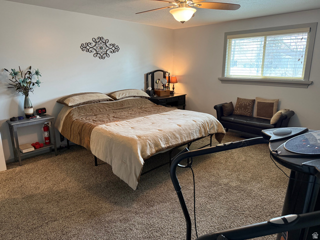 362 East 9150th Street South Sandy, UT 84070 - Photo 24 of 41 Bedroom with carpet floors and ceiling fan