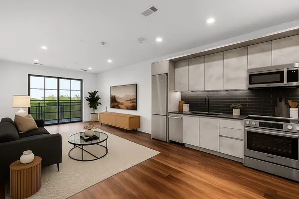 a kitchen with sink refrigerator and stove