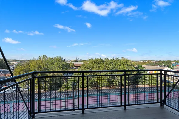 a view of city and mountain from a balcony