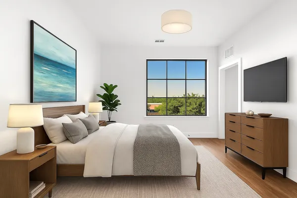 a bedroom with bed tv and window