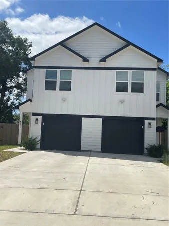 a front view of a house with a garage