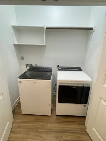a utility room with washer and dryer