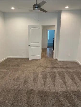 en empty room with closet and windows
