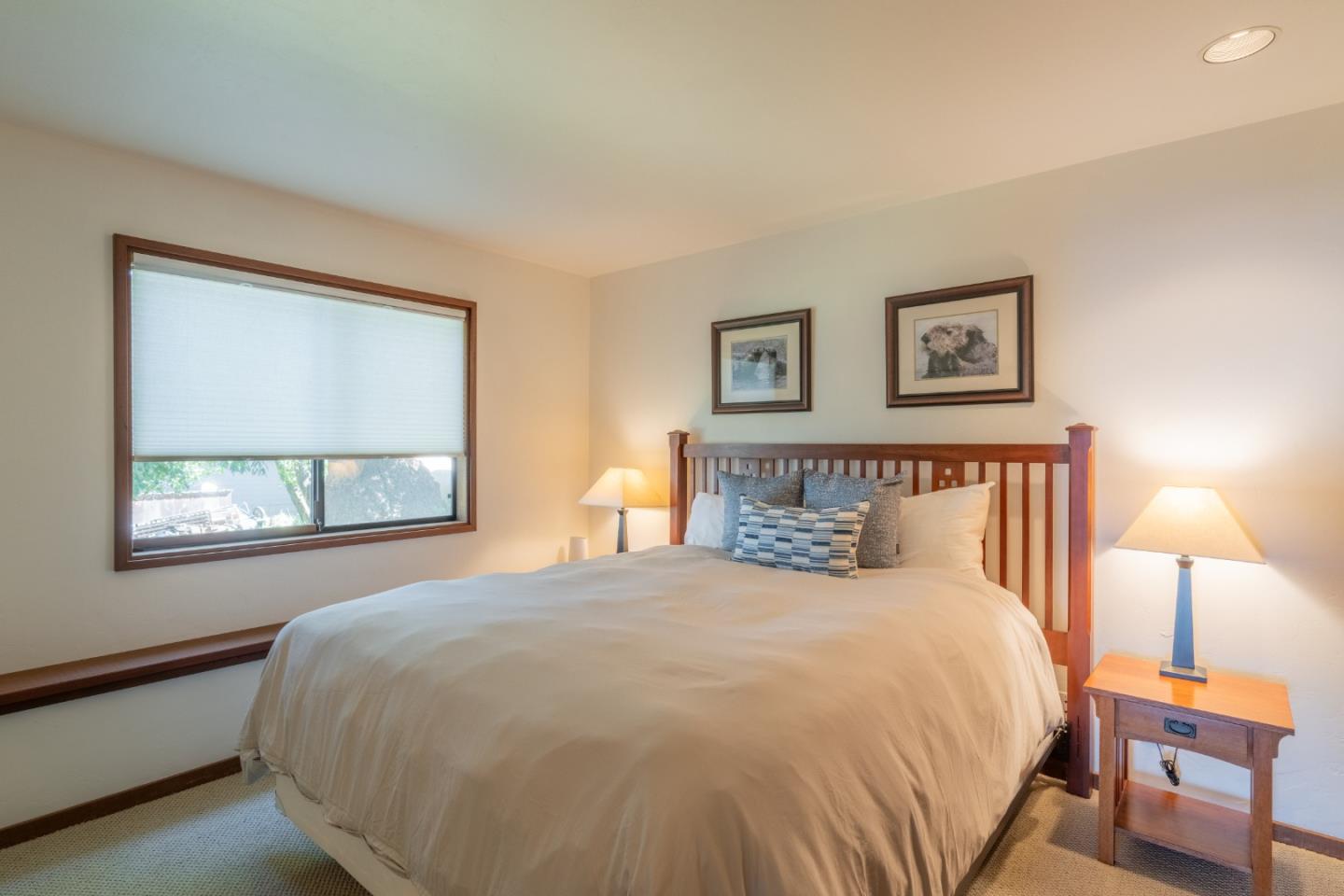 214 Crest Road Carmel, CA 93923 - Photo 20 of 29 a bedroom with a bed and a night stand