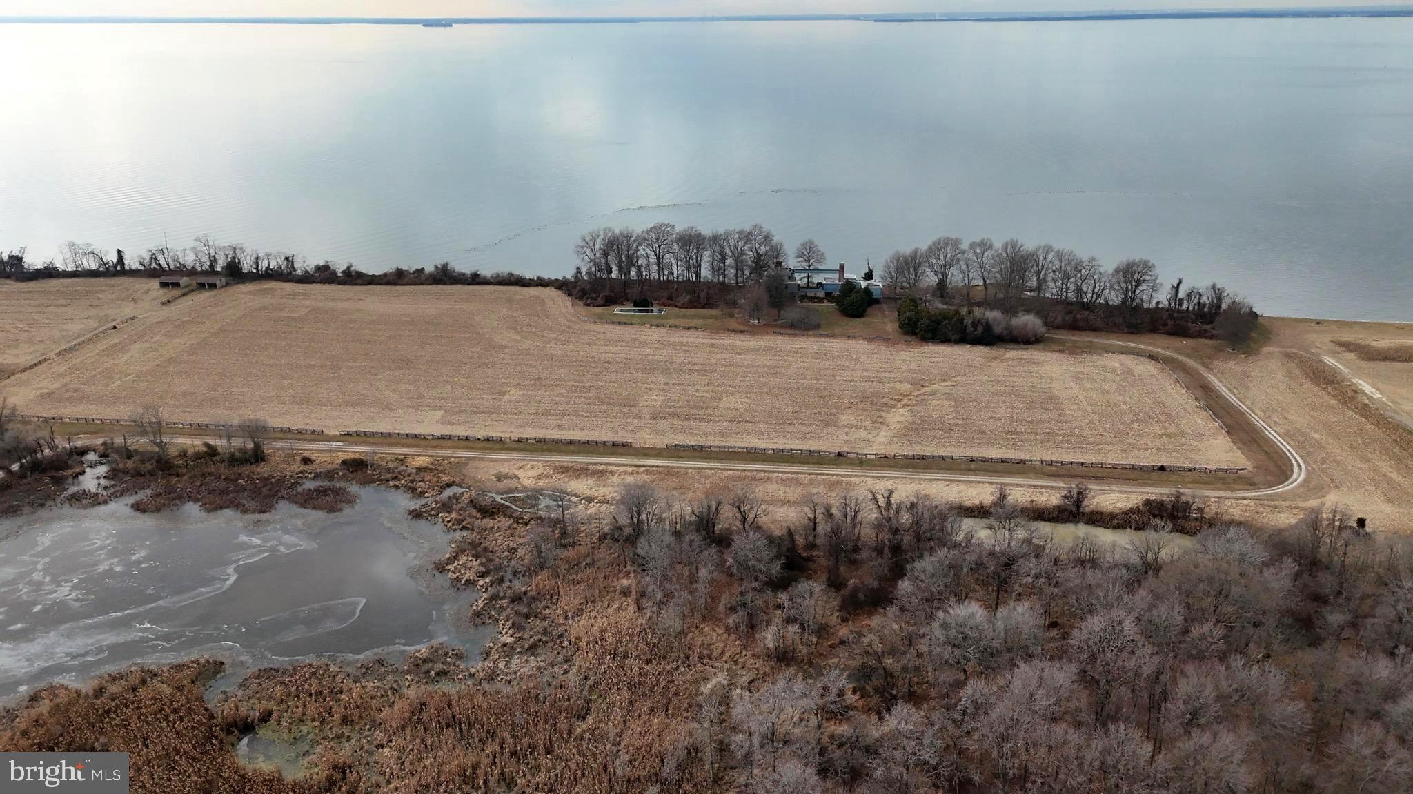 6520 Swan Creek Road Rock Hall, MD 21661 - Photo 23 of 62 a view of a lake with a city