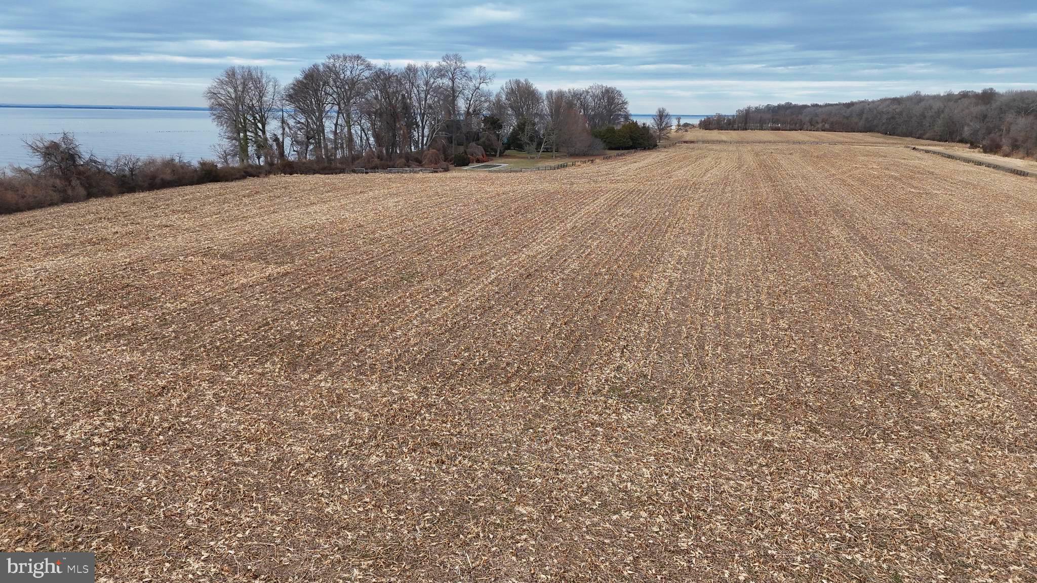 6520 Swan Creek Road Rock Hall, MD 21661 - Photo 29 of 62 a view of dirt field with wooden fence