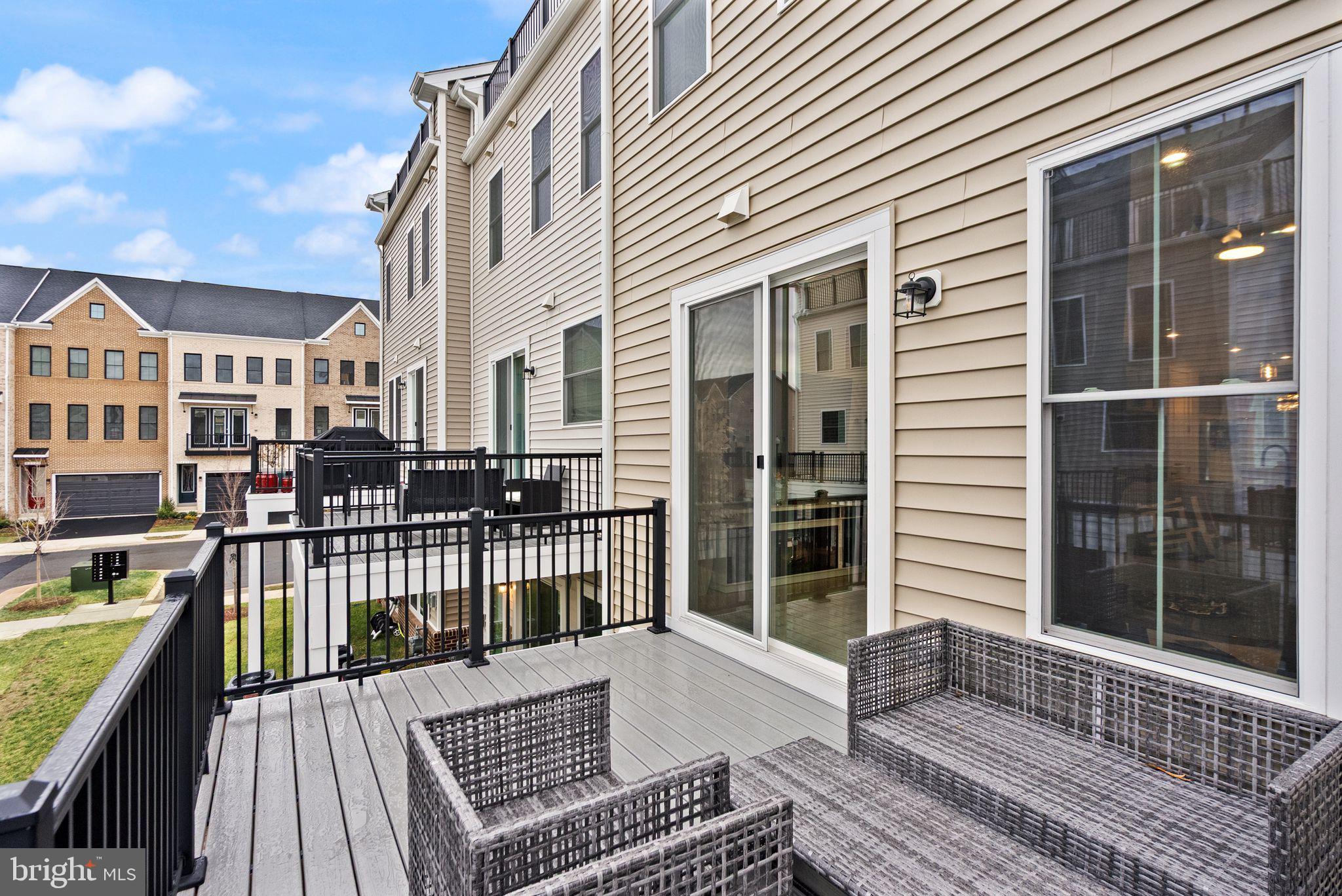23062 Copper Tree Terrace Ashburn, VA 20148 - Photo 11 of 38 a view of a house with a roof deck