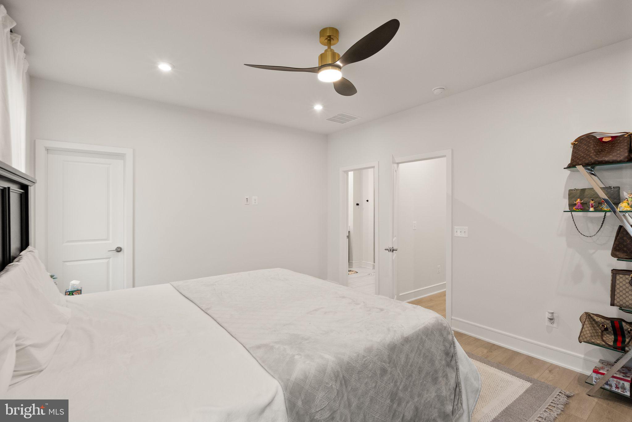 23062 Copper Tree Terrace Ashburn, VA 20148 - Photo 18 of 38 a bedroom with a bed and a tv on table