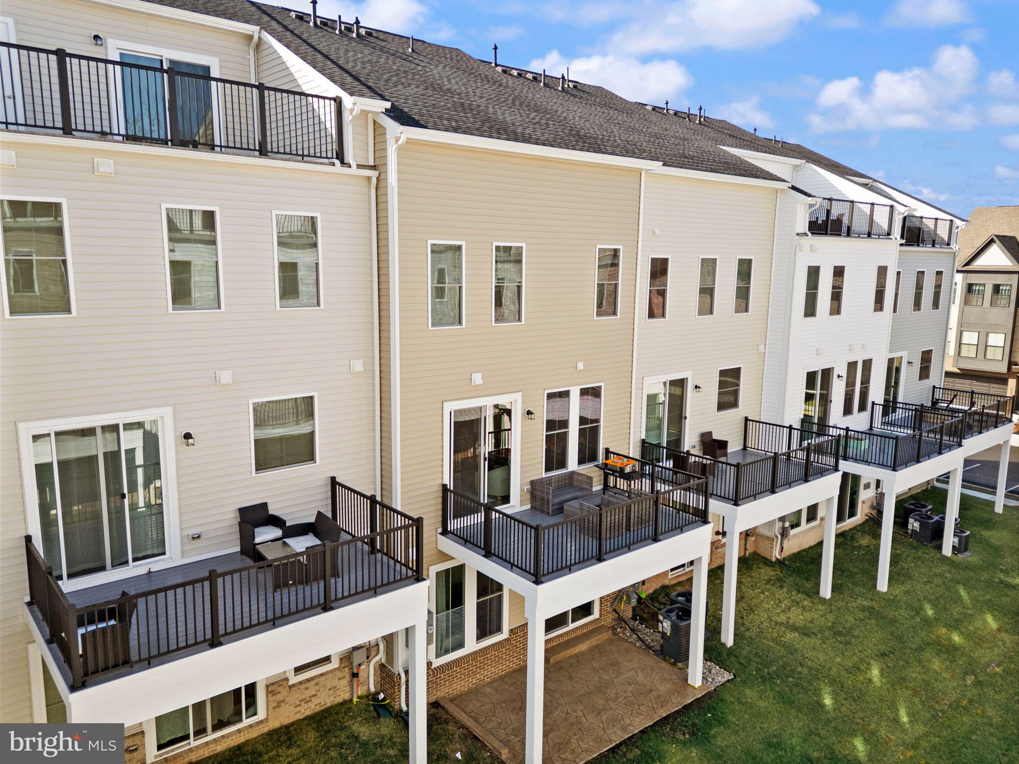 23062 Copper Tree Terrace Ashburn, VA 20148 - Photo 34 of 38 a view of a building with many windows