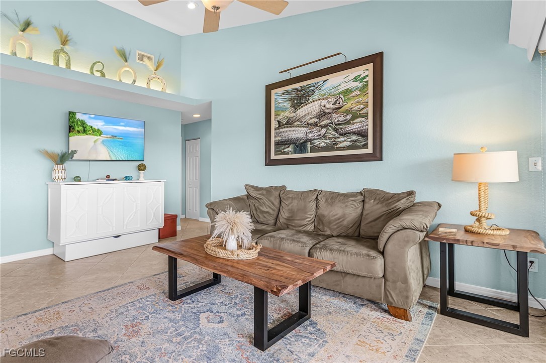 16641 Stringfellow Road, Unit 506 Bokeelia, FL 33922 - Photo 4 of 43 a living room with furniture and a lamp